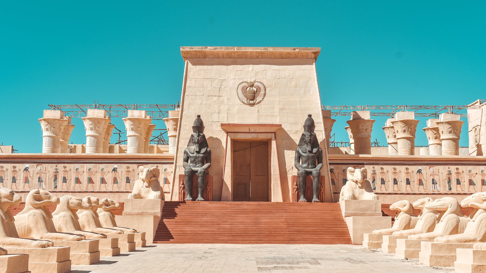 View of the Atlas Film Studios in Ouarzazate, Morocco, known for hosting numerous film productions, featuring sets and landscapes for cinematic storytelling in a desert setting.