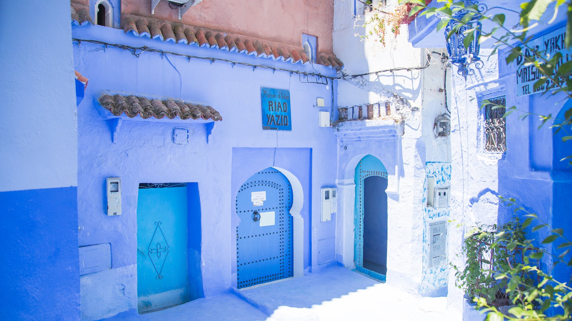 Image of the blue-washed paths in Chefchaouen, Morocco. Serene streets adorned with buildings painted in shades of blue, winding alleys, and glimpses of local life, capturing the town's unique charm and cultural blend