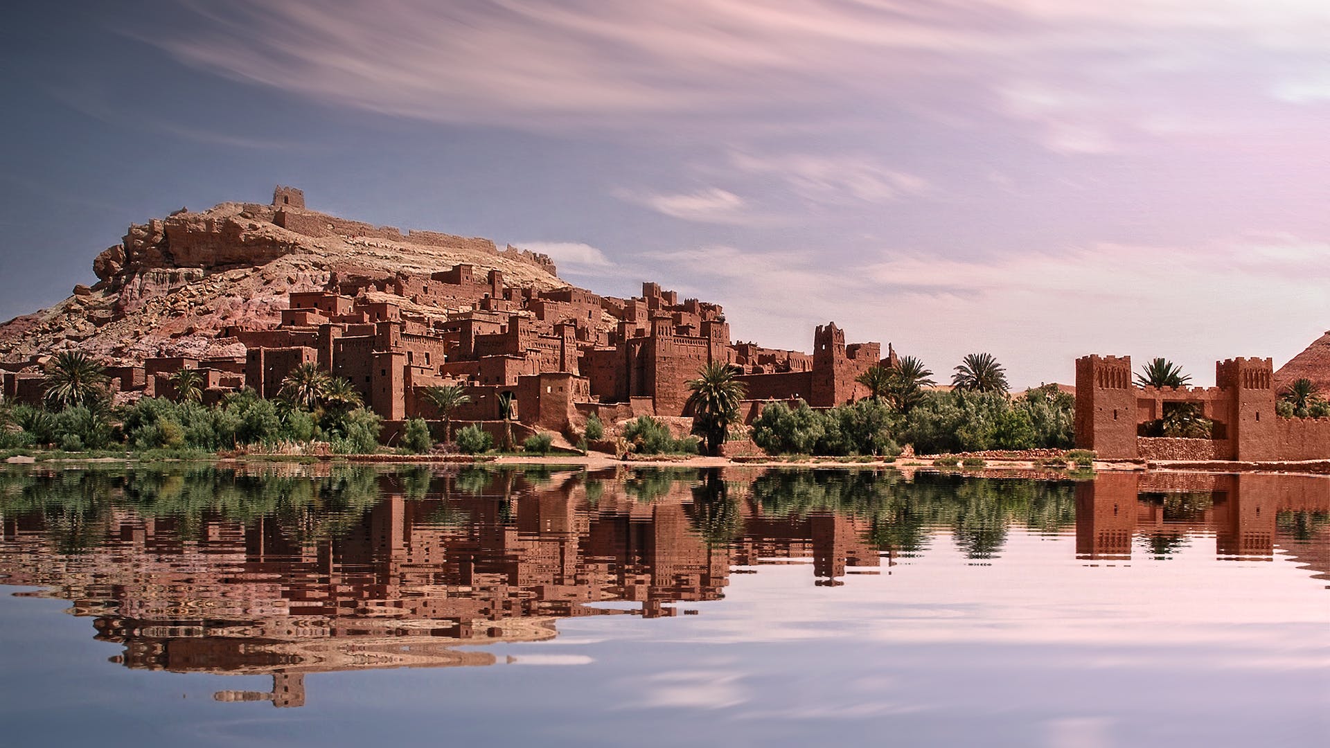 Image of a Moroccan kasbah, showcasing the distinctive mud-brick architecture and fortified walls. This historical fortress stands as a testament to Morocco's rich heritage and architectural prowess, symbolizing protection and cultural significance.